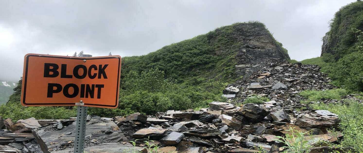 A blocked road in Alaska highlights the importance of bikepacking pre-trip considerations, ensuring riders are prepared for unexpected challenges.