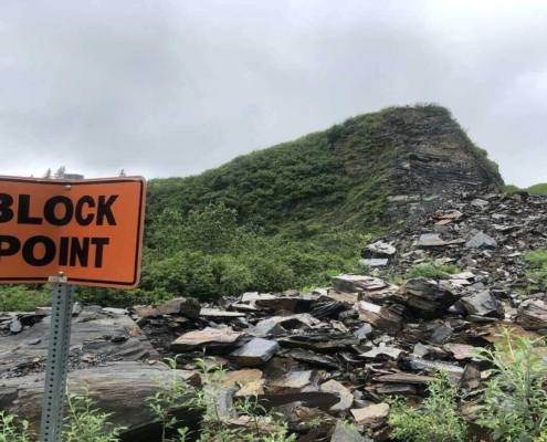 A blocked road in Alaska highlights the importance of bikepacking pre-trip considerations, ensuring riders are prepared for unexpected challenges.