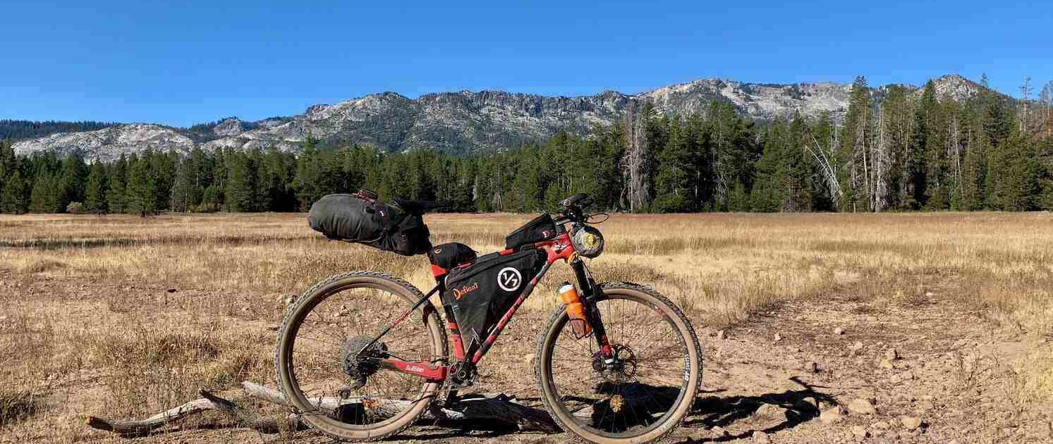 A fully loaded bike during a shakedown ride to test bikepacking gear and setup before a big trip.