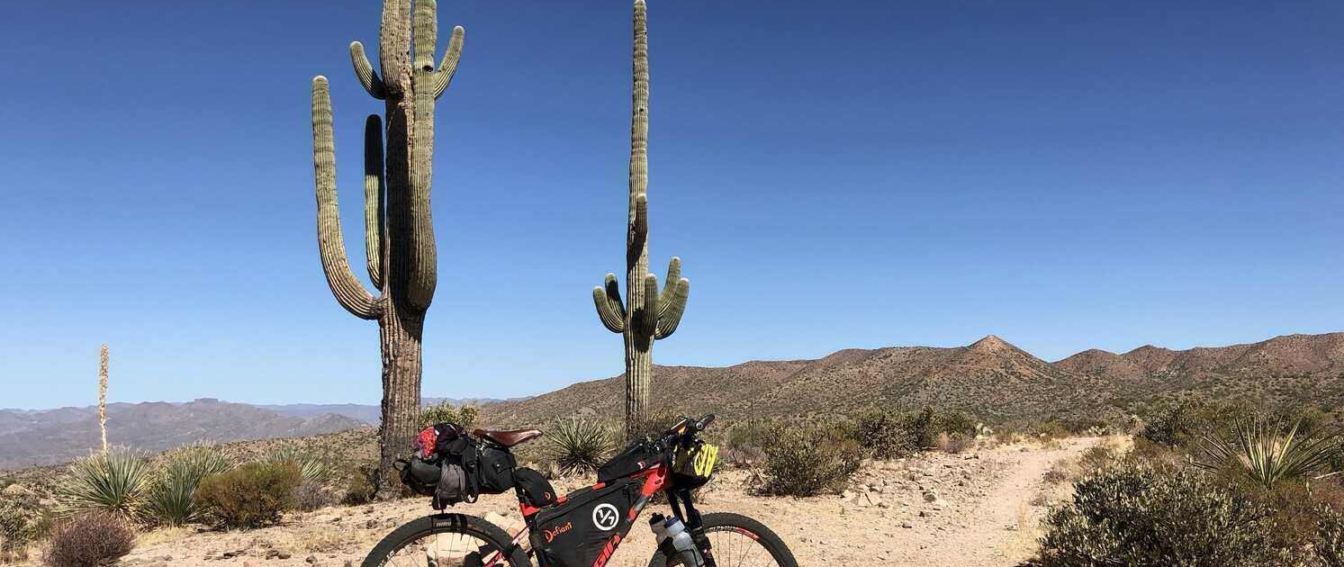 Traveling to and from the Arizona Trail, covered in the Arizona Trail Transportation Guide, with desert landscapes along the way.